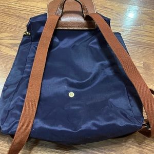 longchamp or pikage backpack. Blue